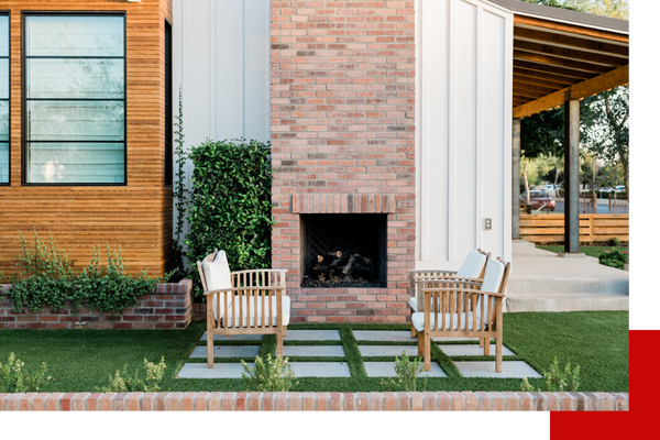 backyard patio with chairs and neatly kept grass